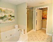 Large guest bedroom with ocean view window